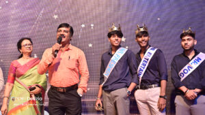 Teacher addressing 3 freshers party winners