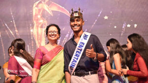 Student getting awarded as Mr entertainment