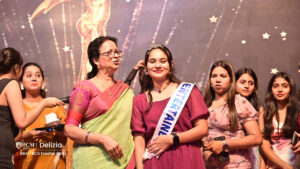 Student getting awarded as Miss entertainment