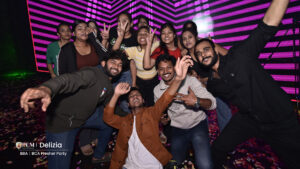 Studnets posing for a photo at a college festival.