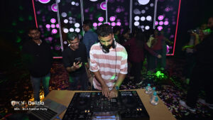 DJ playing music at a college freshers party.