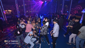 Students dancing at a college freshers party.