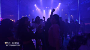 Students dancing at a college freshers party.