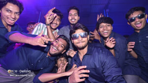 Group of students posing for photograph in freshers party