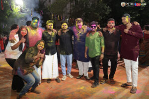Students enjoying Holi at RCM with music, dance, and colorful vibes.