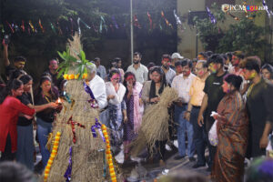 Students gathered around the Holika Dahan bonfire for rituals.