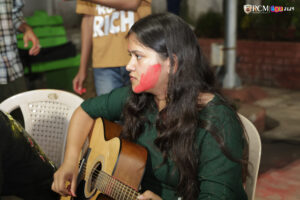 A student enjoying Holi while playing a soulful tune on the piano.