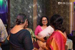 Guests enjoying the vibrant atmosphere at Lumora event