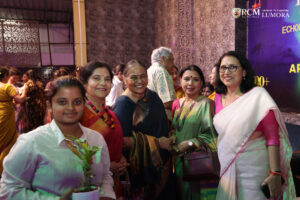 Woman artist creating live artwork during Lumora event