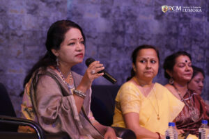 Woman filmmaker discussing her journey in film at Lumora