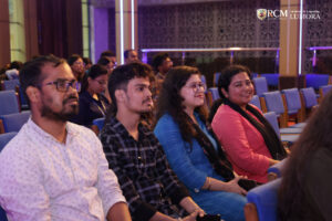 ttendees listening attentively during a panel discussion at Lumora