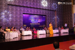 Guest delivering an inspiring speech at Lumora event