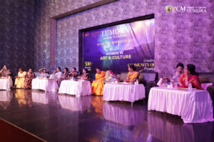 Woman filmmaker showing clips of her work at Lumora