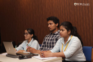 Attendees watching a documentary highlighting women in media during the event