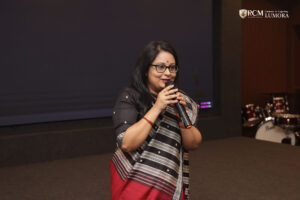 Woman media executive sharing her experiences and career journey with the audience