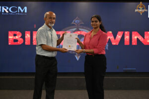 Participants receiving awards during the BID TO WIN 2025 prize distribution ceremony at RCM.