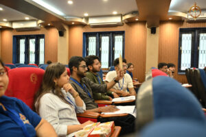 Participants engaged in a simulated stock market trading challenge during BID TO WIN at RCM Brahmastra 2025.