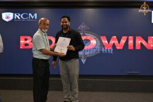 Prize distribution ceremony of BID TO WIN event at RCM, recognizing participants for their financial strategy and performance.