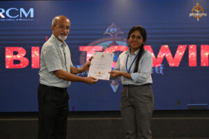 participants receiving prizes during the “Bid to Win” event at RCM, celebrating financial strategy and market simulation excellence.