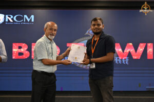 Winners and participants receiving awards during the Bid to Win prize distribution ceremony at RCM.