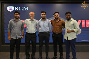 Judge evaluating participants during the high-stakes Bid to Win stock market simulation event at RCM.