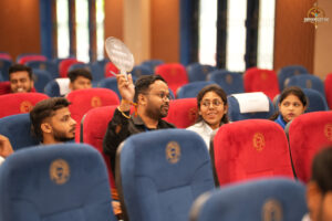 Students actively participate in a high-stakes stock market simulation during BID TO WIN at RCM.