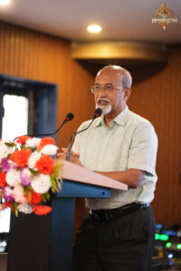 Judge delivering a speech during the BID TO WIN event at Brahmastra 2025, Regional College of Management.