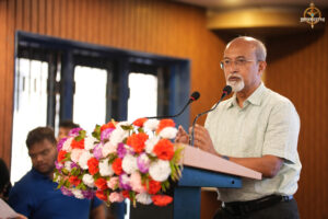 Judge delivering a speech during BID TO WIN 2025 event at RCM.