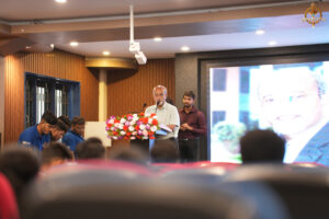 Judge delivering an opening speech at the Bid to Win financial simulation event at RCM.