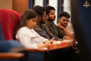 Participants engaged in strategic conversation during the high-stakes BID TO WIN event at RCM.