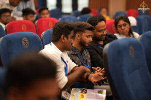 Participants engaged in strategic discussion during the BID TO WIN stock market simulation at RCM.