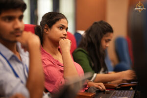 Participants engaged in the high-stakes “Bid to Win” stock market simulation at RCM.