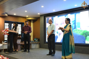 RCM Dean and BID TO WIN judge overseeing participants during the financial simulation event.