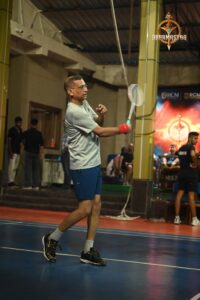 "Badminton singles match during Kurukshetra at Brahmastra 2025, RCM Bhubaneswar"