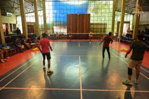 Badminton doubles match in progress during Kurukshetra event at Brahmastra 2025 college fest