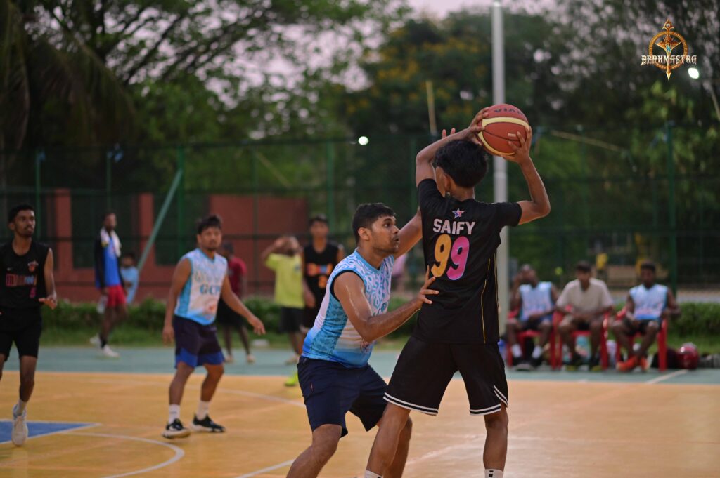 Student players in an intense basketball match during Brahmastra 2025 at RCM Bhubaneswar