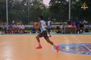 Students competing intensely in a basketball match during Brahmastra 2025 college fest