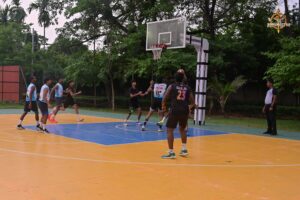 Students competing in an intense basketball match during Kurukshetra at Brahmastra 2025 at RCM Bhubaneswar