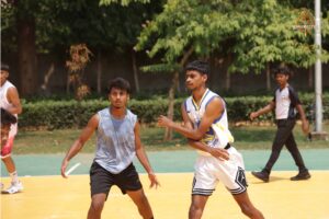 Basketball players mid-game during Kurukshetra at Brahmastra 2025, RCM Bhubaneswar
