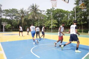 Players competing in an intense basketball match during Brahmastra 2025 event at Regional College of Management, Bhubaneswar