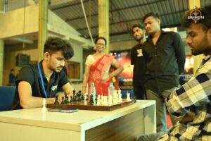 Students engaged in an intense chess match during Kurukshetra at Brahmastra 2025 college fest, RCM Bhubaneswar.