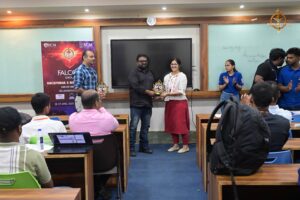 College festival judge being honored by director during Brahmastra 2025 at top management college in India.