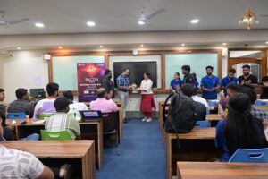 Director Sanghamitra Pal honors chief guest during Build With AI hackathon at top management college festival Brahmastra.