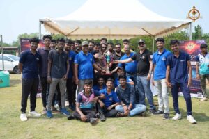 RCM cricket team celebrates second place win at Ranbhoomi 2025 with trophy in hand during Brahmastra intercollege tournament.