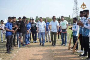 Sponsor of Brahmastra 2025 standing with faculty members and student players at Kurukshetra event.