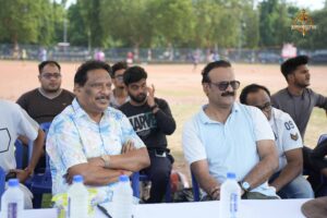 Cricket match in progress during Ranbhoomi at Brahmastra 2025 with players in action and crowd in the background at Railway Sports Complex.