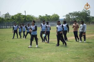 Cricket players from participating colleges standing in formation during Ranbhoomi at Brahmastra 2025.