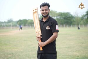 RCM cricket team captain holding his bat confidently before the match at Brahmastra 2025.