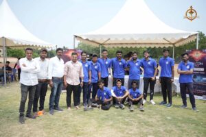 Team of cricket players posing together during Ranbhoomi at Brahmastra 2025 in official jerseys