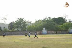 Cricket teams in action during a match at the Ranbhoomi tournament, part of Brahmastra 2025.